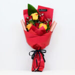 ورد أحمر واصفر ملغف بتغليف جميل باللون الأحمر Yellow and red flowers wrapped in the beauty of red